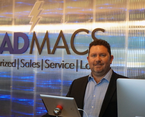 Scott Kirchner of Mad Macs with Logo